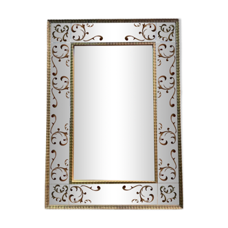 Venetian mirror in eglomise glass and gilded wood