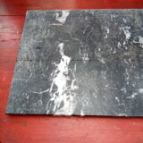 White veined black marble fireplace