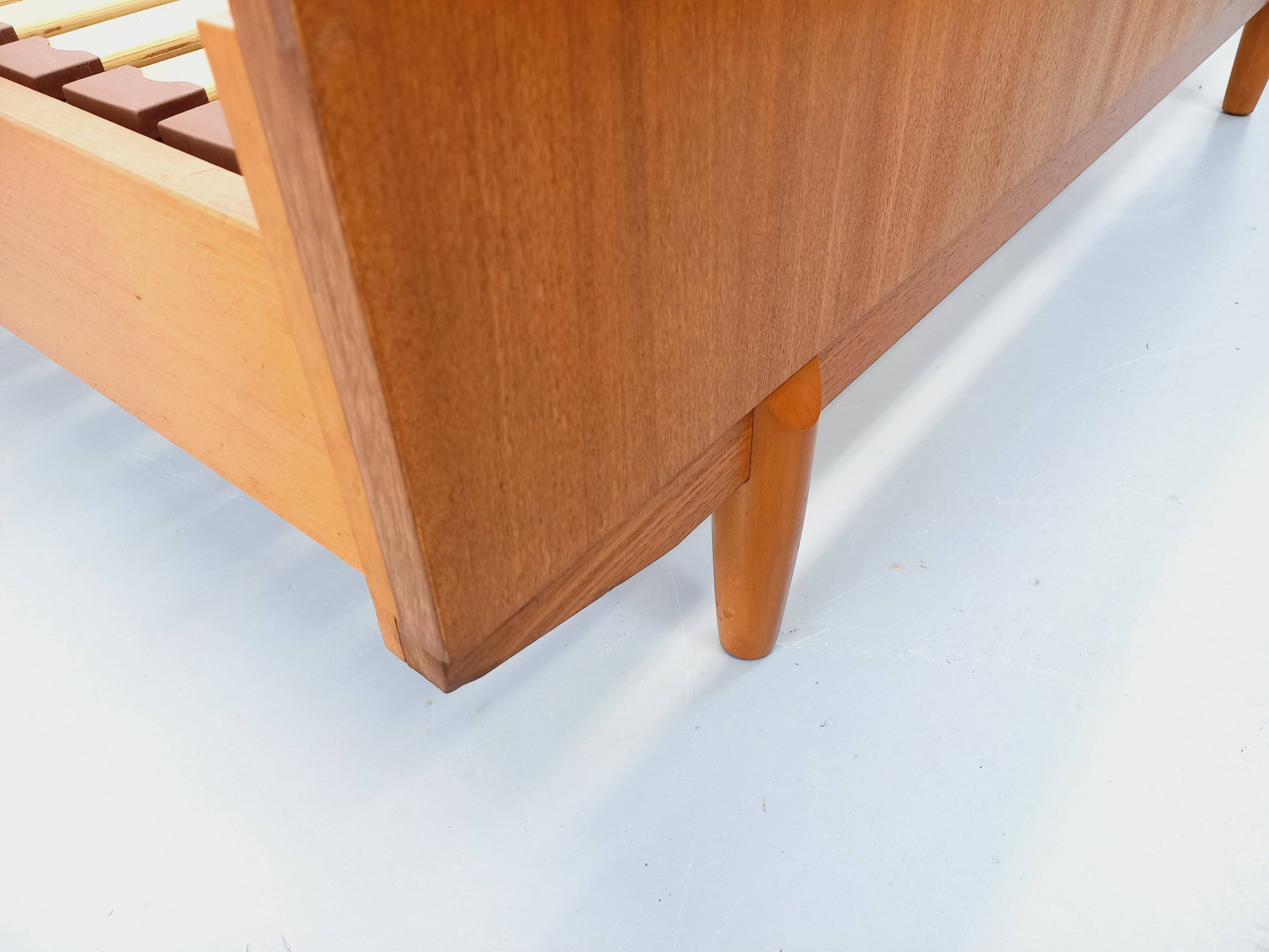 Double bed vintage Scandinavian in teak from the 1960s with integrated bedside tables.