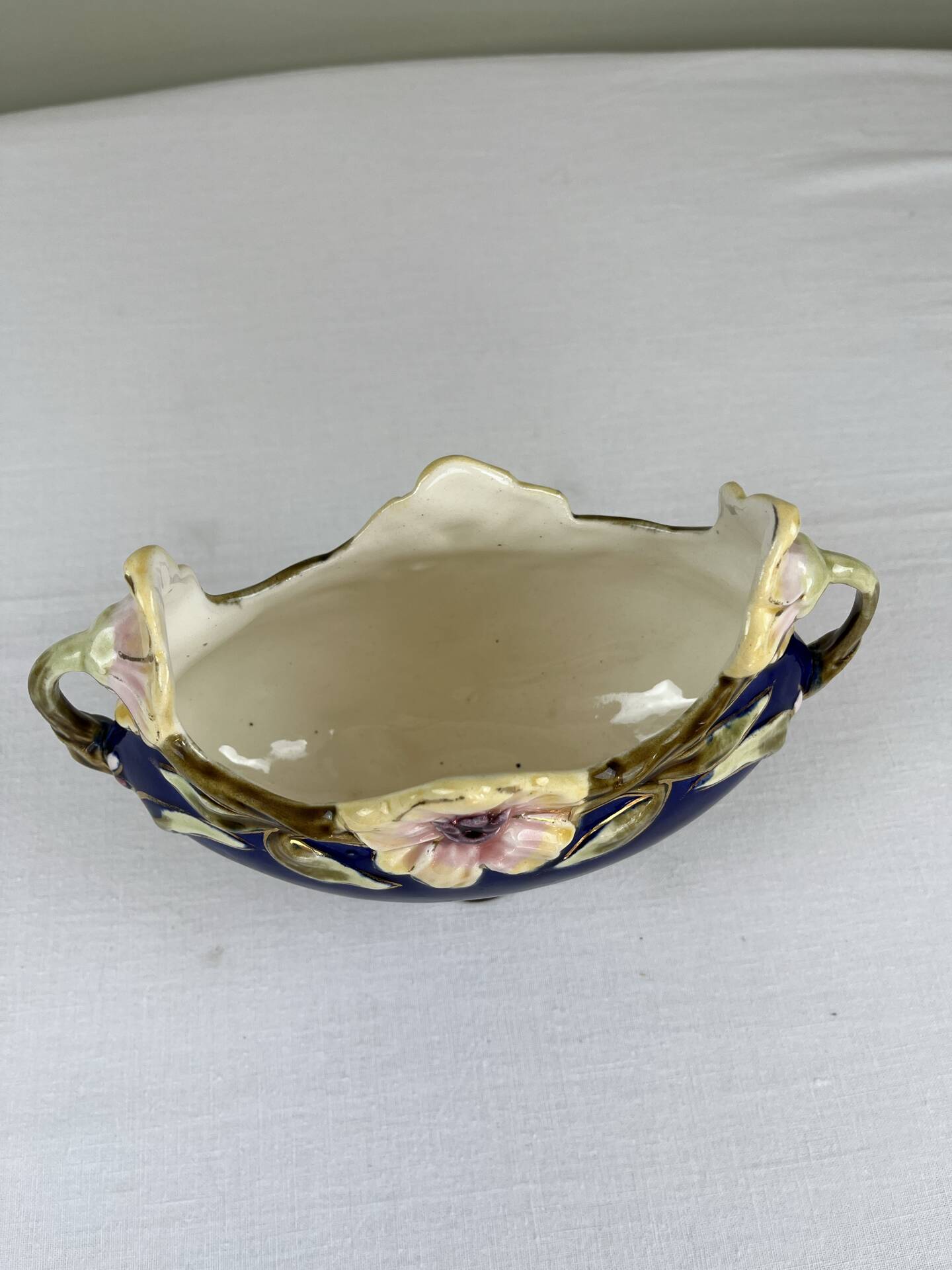 Art Nouveau navy blue barbotine bowl with raised floral decoration