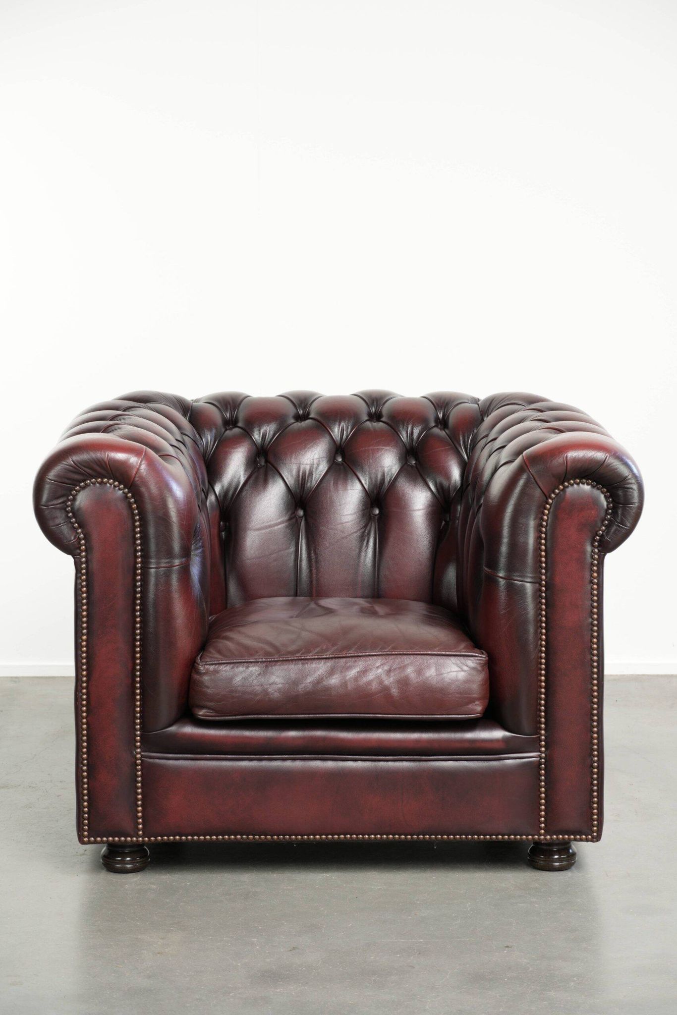 English cowhide Chesterfield club armchair in a beautiful red colour