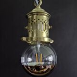 Brass pendant light with oversized LED bulb