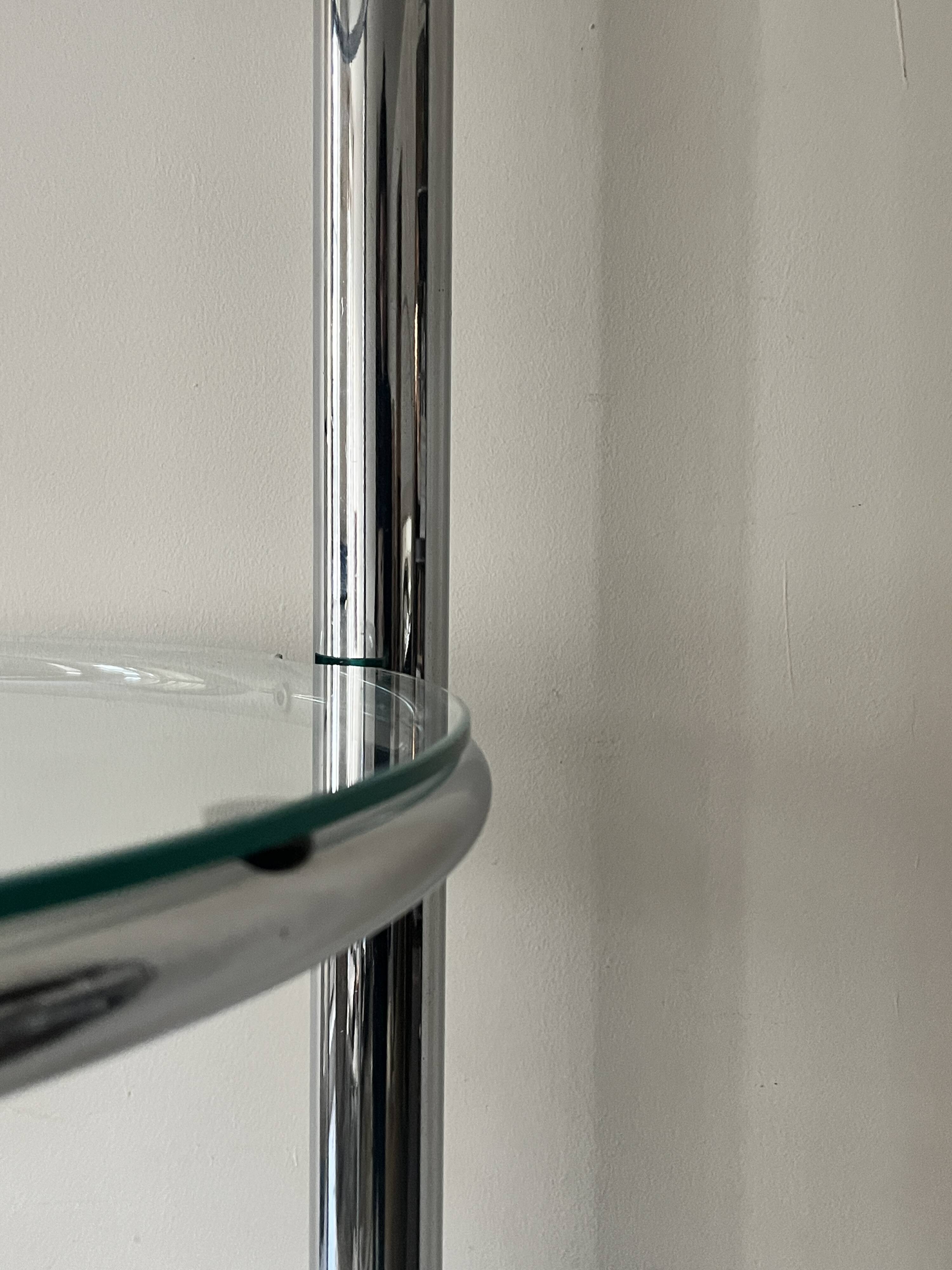 Round tubular bookcase in chrome and glass, 1970 design