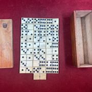 Set of complete dominoes made of bone, nails and blackened wood