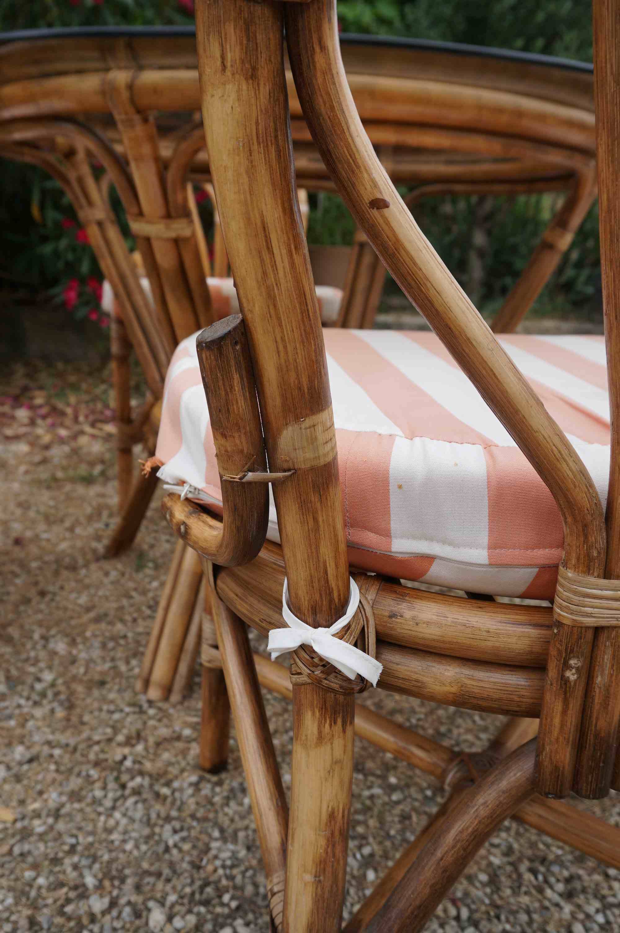 dining table and chairs made of curved bamboo and rattan with smoked glass from the 1970s