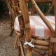 dining table and chairs made of curved bamboo and rattan with smoked glass from the 1970s