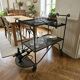 Perforated wrought iron rolling dessert trolley