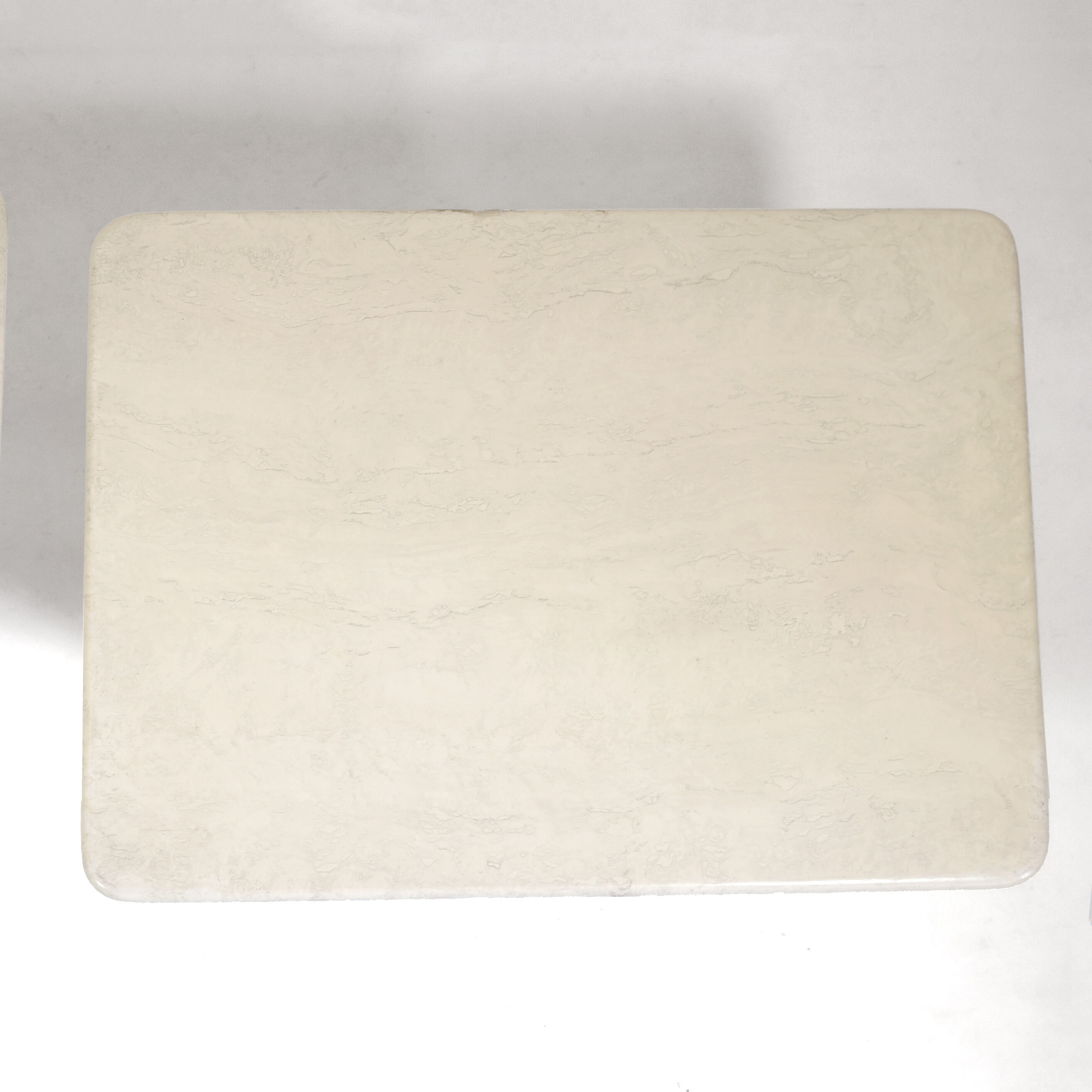 Pair of travertine trundle tables, Italy