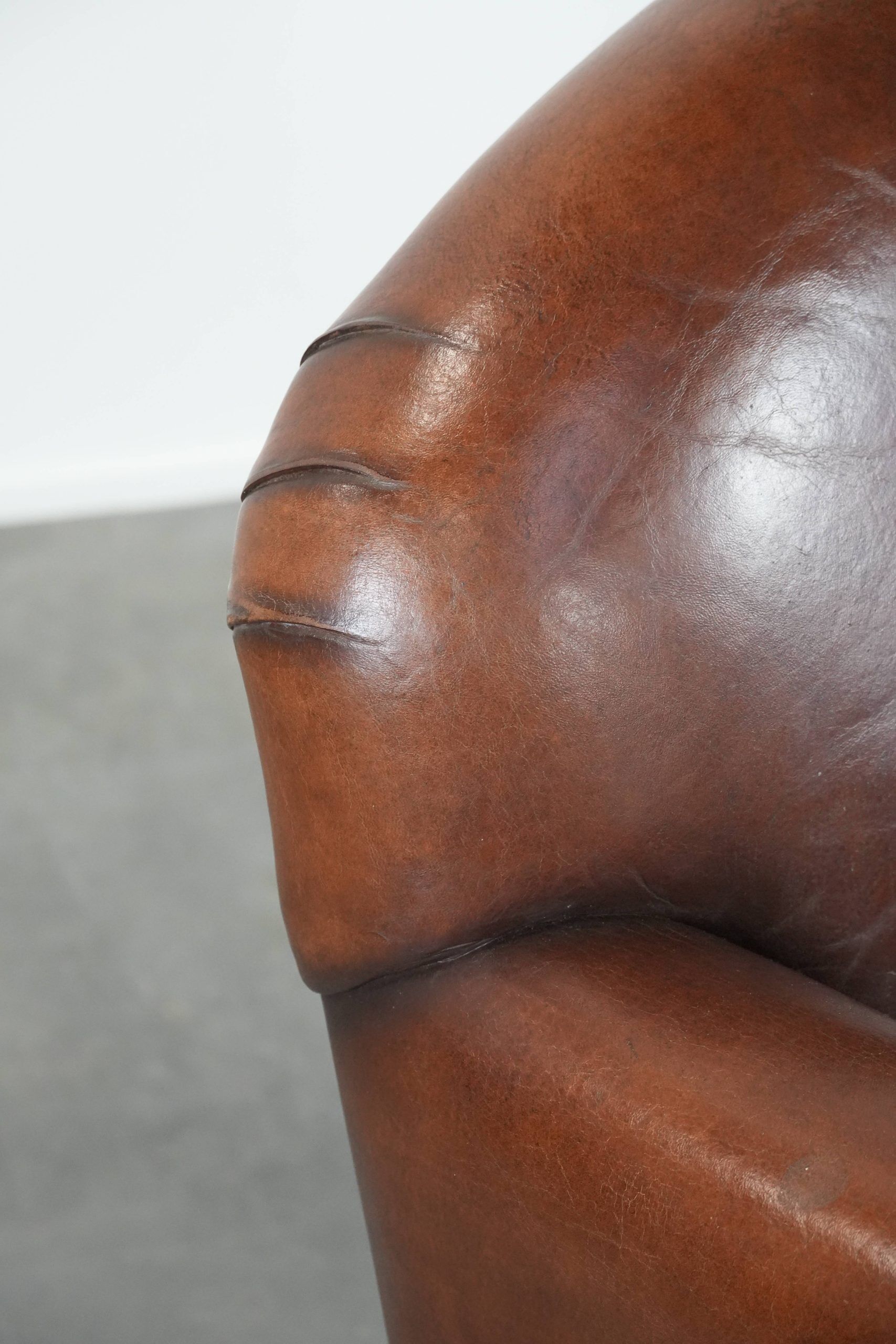 Armchair made of sheepskin leather in art deco design with warm colours