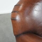 Armchair made of sheepskin leather in art deco design with warm colours