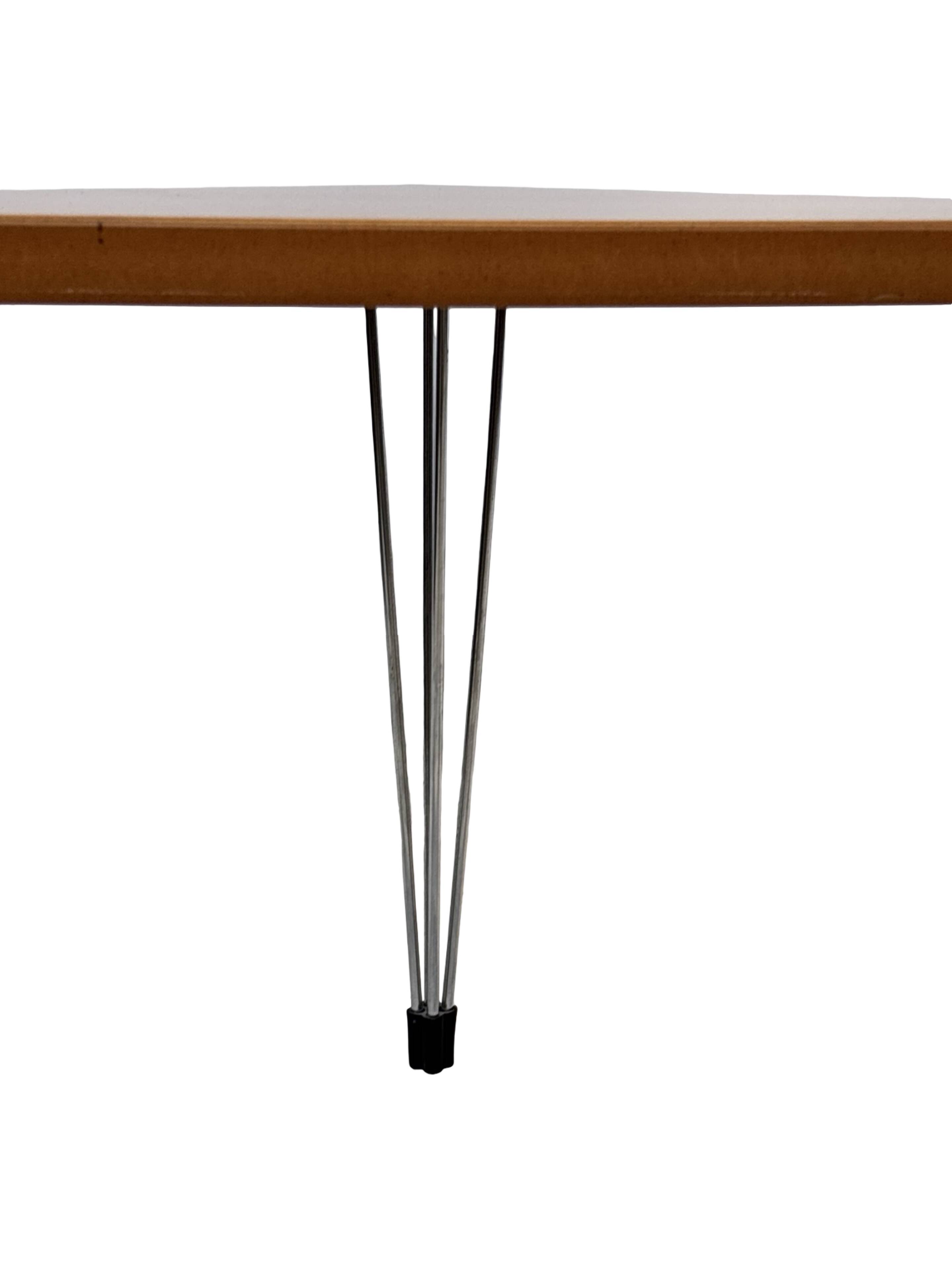 Vintage Danish triangular side table with hairpin legs design