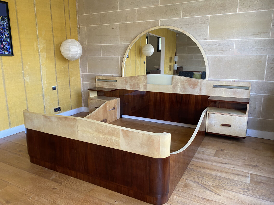 Bed with integrated bedside in rosewood and parchment, art deco period, twentieth century