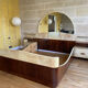 Bed with integrated bedside in rosewood and parchment, art deco period, twentieth century