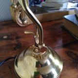 Articulated shell lamp in gold metal
