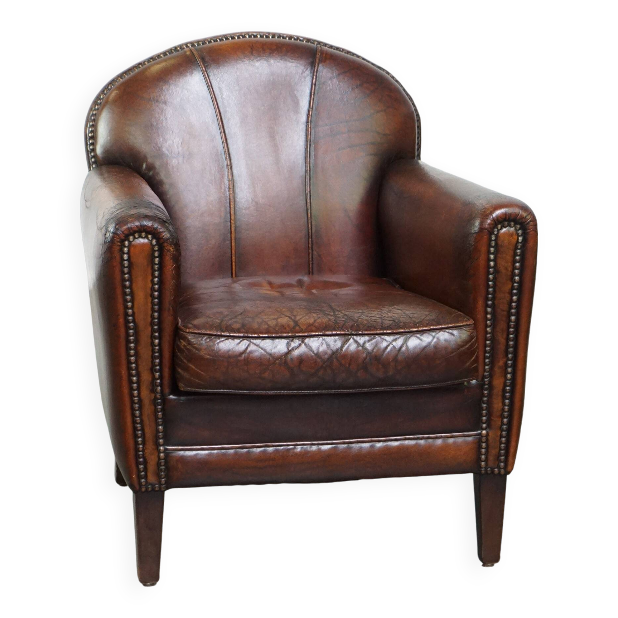 A vintage-style armchair with character, upholstered in beautifully patinated sheepskin.