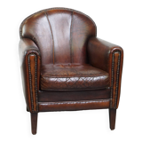 Characterful vintage design armchair made from beautifully patinated sheepskin