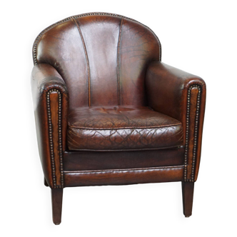 Characterful vintage design armchair made from beautifully patinated sheepskin