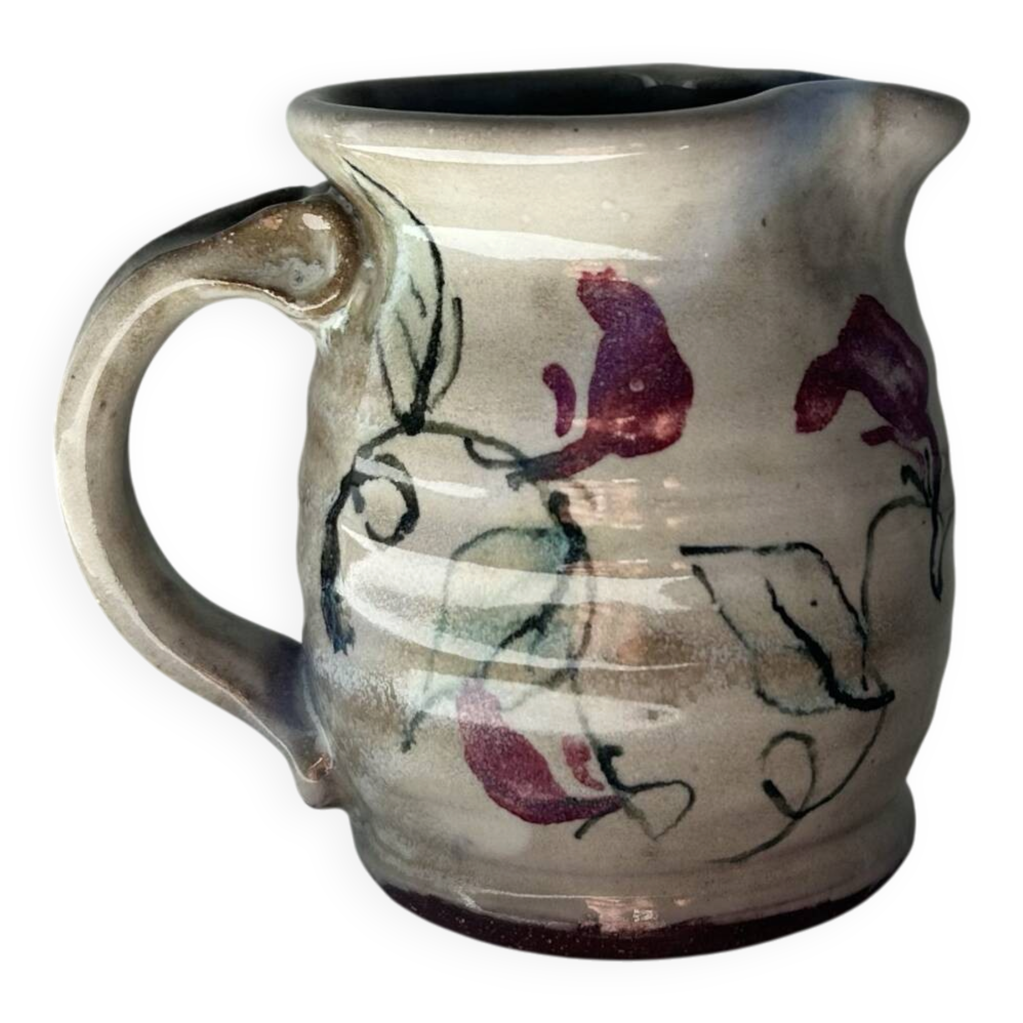 Floral decorated pitcher signed