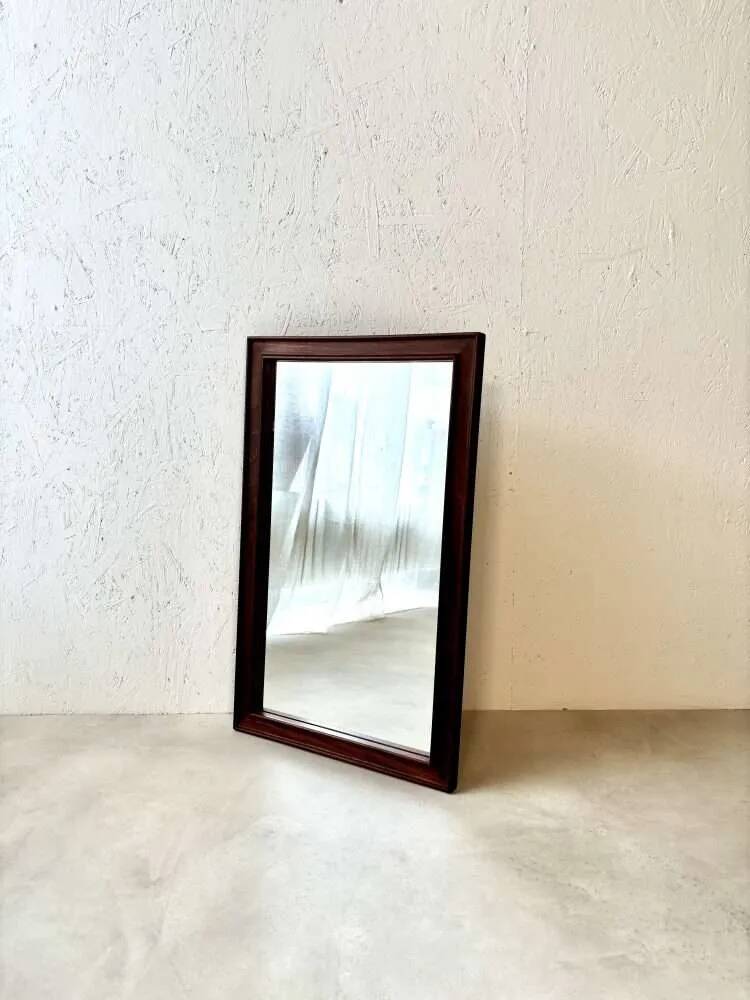 Danish wall mirror from the sixties with a sleek design.