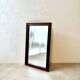 Danish wall mirror from the sixties with a sleek design.