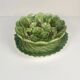 Leaf and strawberry-shaped bowl/strainer.