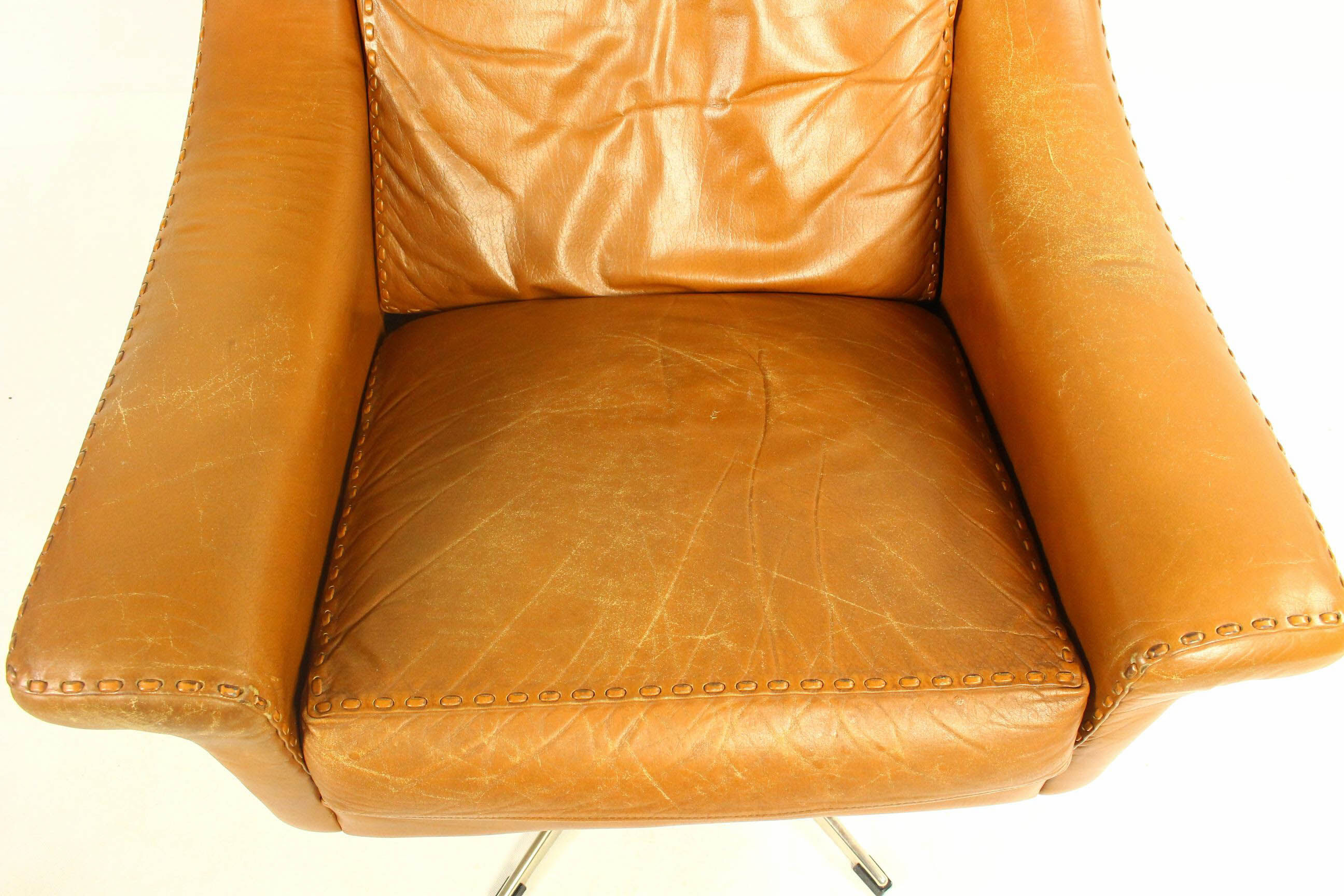 Matador swivel leather chair with ottoman by Aage Christiansen for Erhardsen & Andersen, 1960s