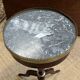 Mahogany gueridon with marble top from the 1950s.