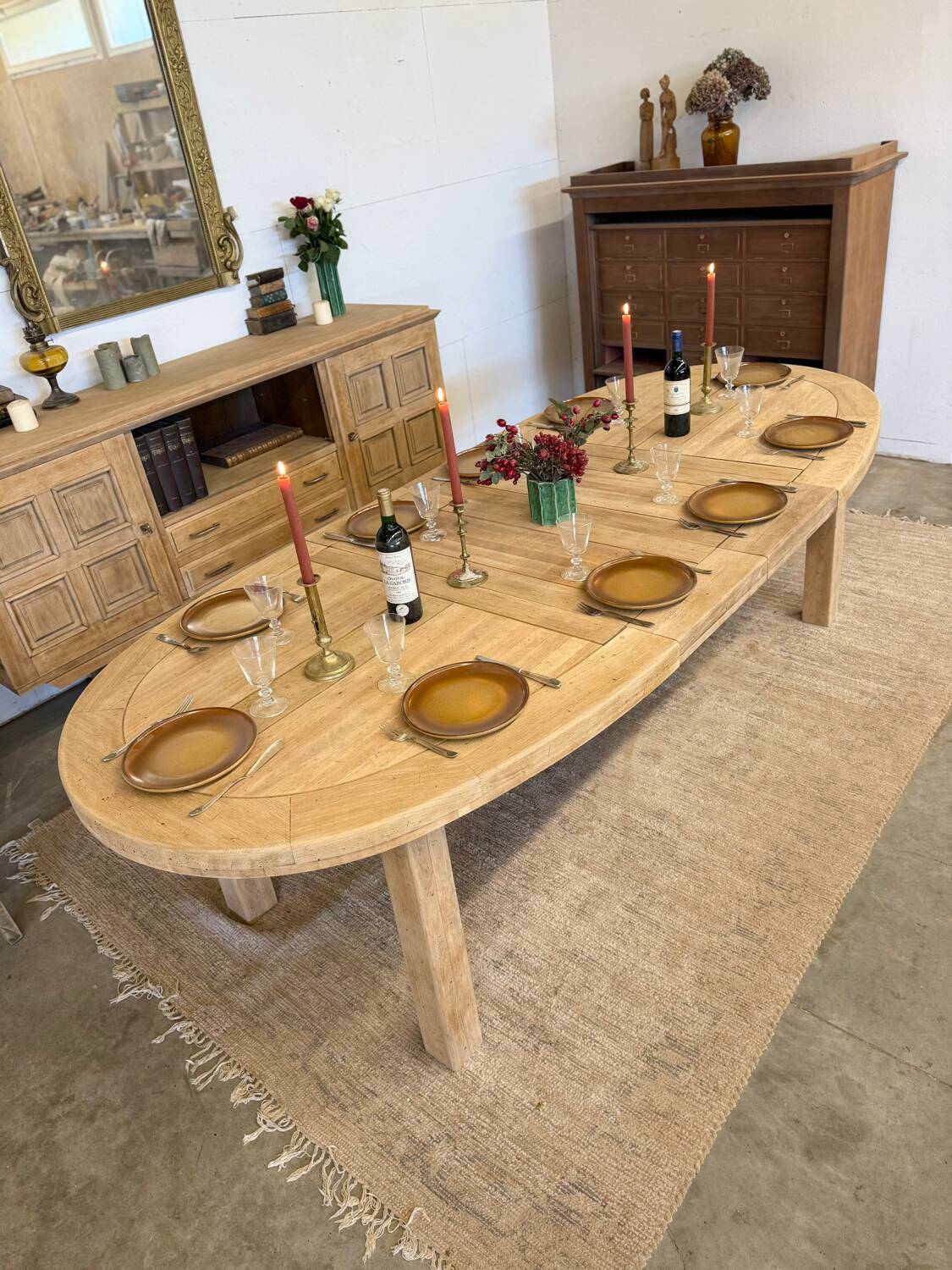 Oval farmhouse table in solid oak with extensions.