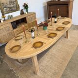 Oval farmhouse table in solid oak with extensions.