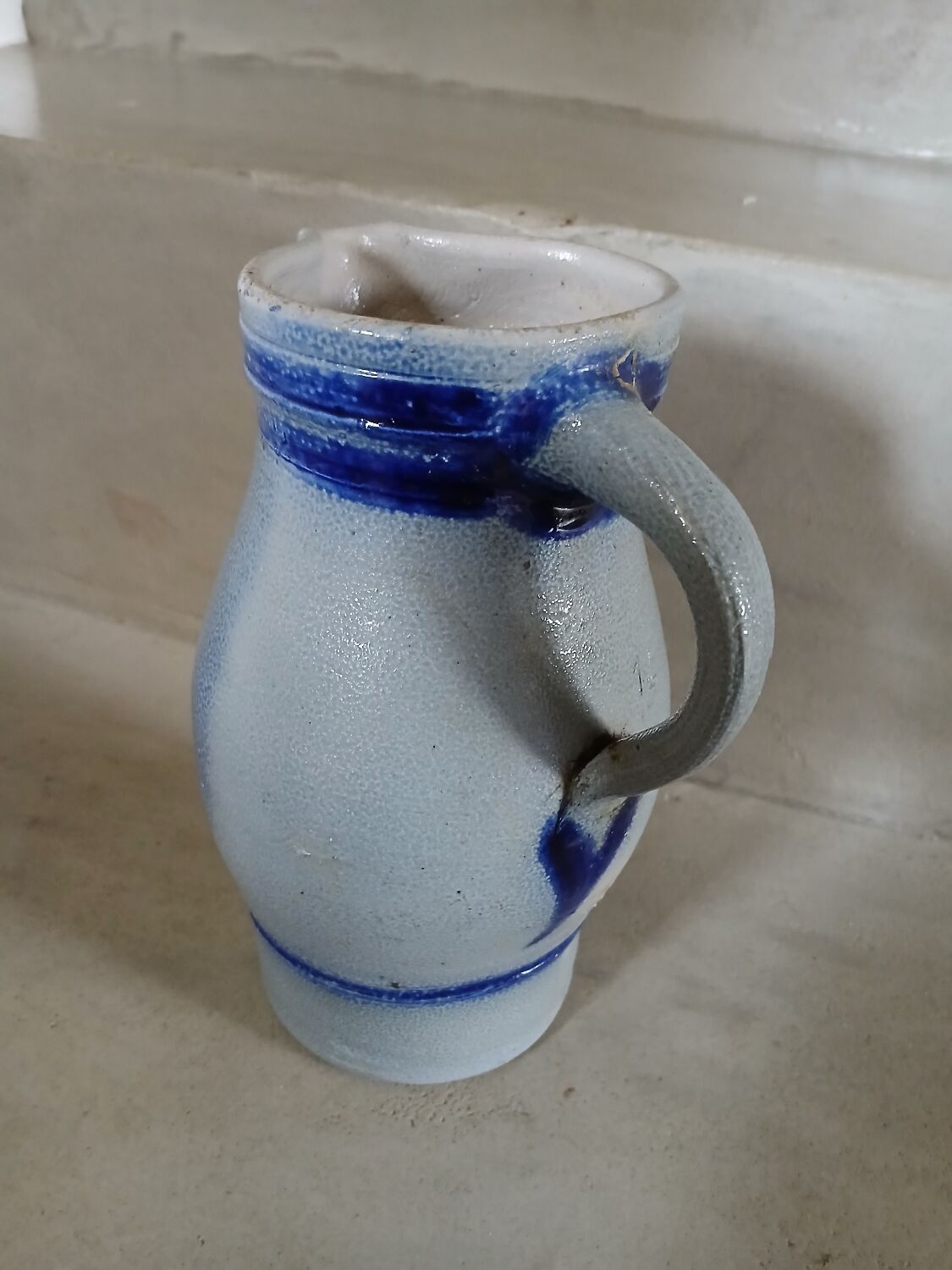 2 antique stoneware pitchers