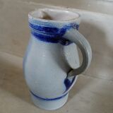 2 antique stoneware pitchers