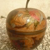 Partitioned brass apple