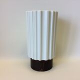 White vase on wooden base