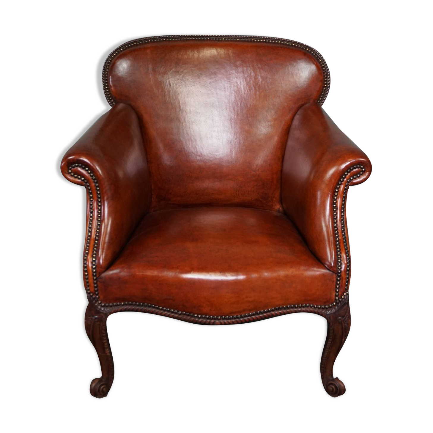 Old armchair in sheep leather