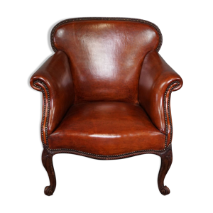 Fauteuil ancien en cuir de mouton