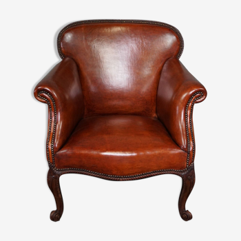 Old armchair in sheep leather