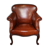 Old armchair in sheep leather