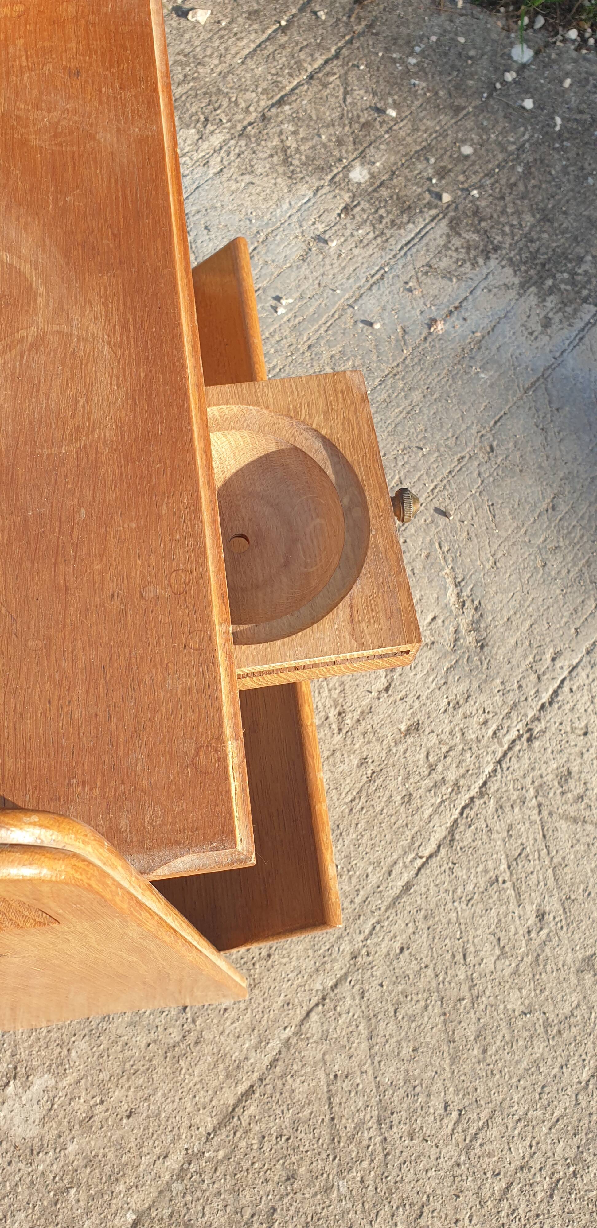 Magazine rack with sliding drawers in light wood, Scandinavian style.