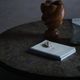 Round brutalist coffee table in stone and steel, mid-century French modernism, 1970s.