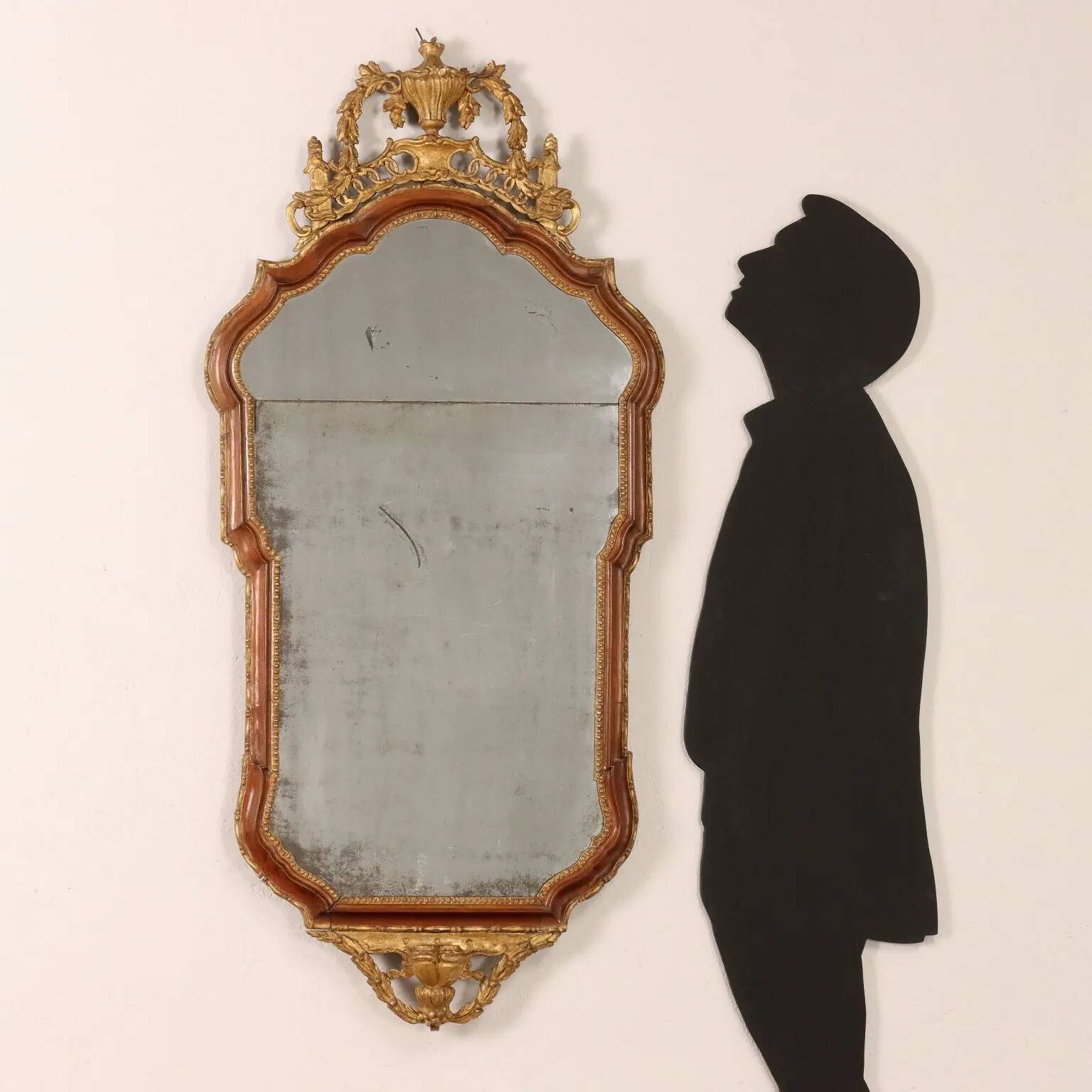 Neoclassical antique mirror in walnut, Italy, 18th century.