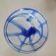 Old white and blue glass flower vase