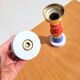 Pair of coloured and gold wooden candlesticks