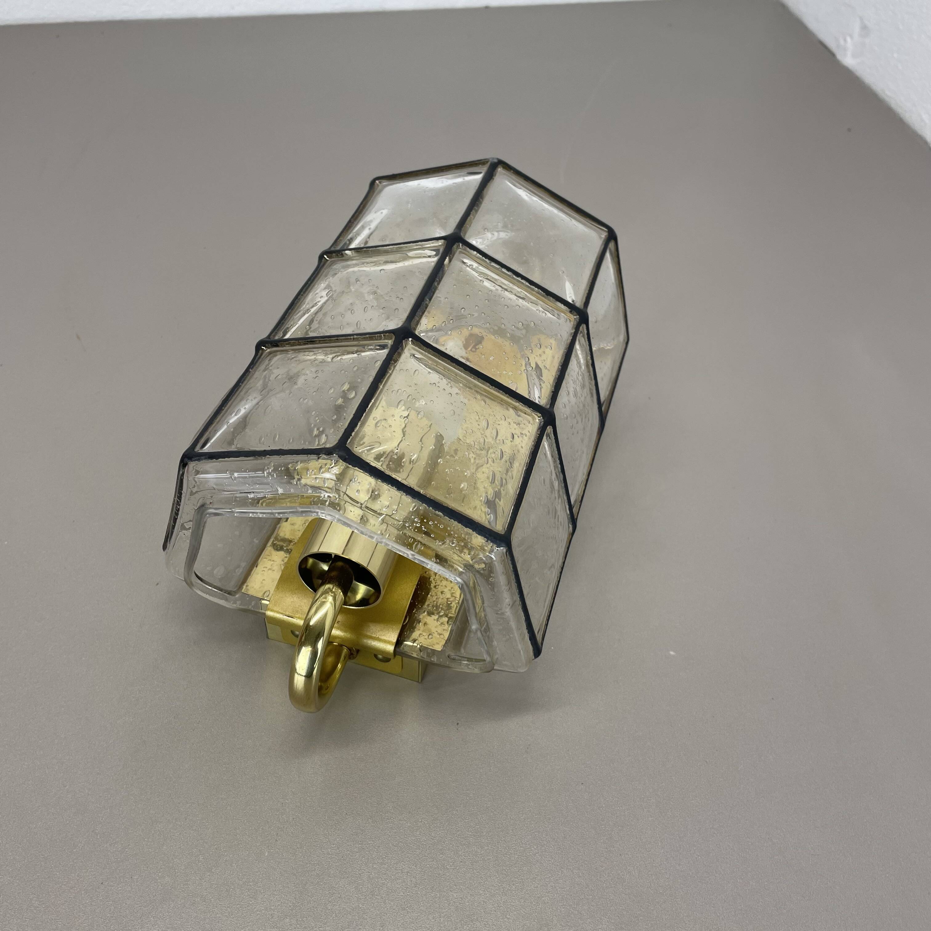 Wall light "Iron Rings" in brass and glass by Glashütte Limburg, Germany, 1970s