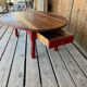 Oval coffee table in wood and red