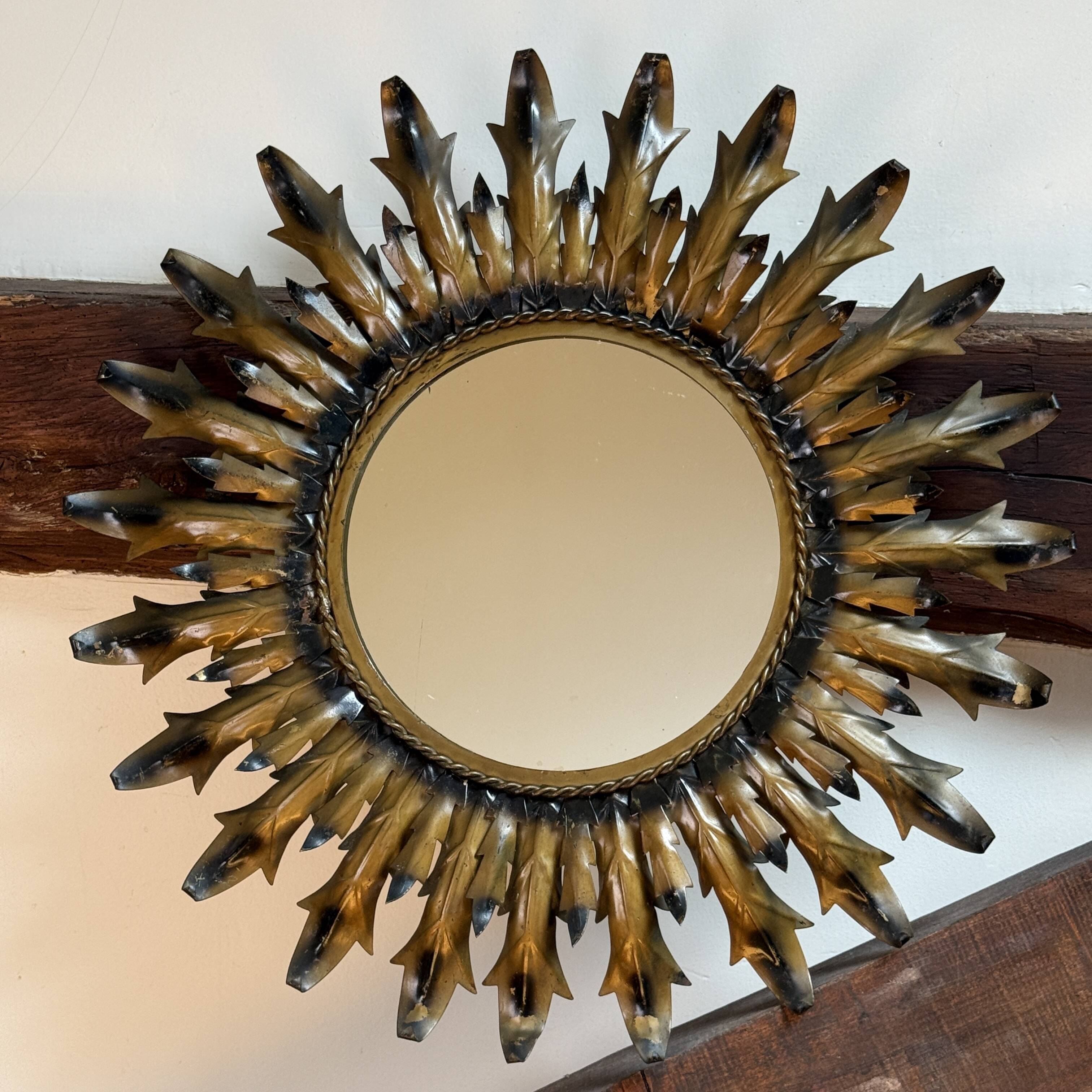Sun mirror in wrought iron from the 1950s Italy.