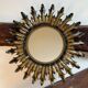 Sun mirror in wrought iron from the 1950s Italy.