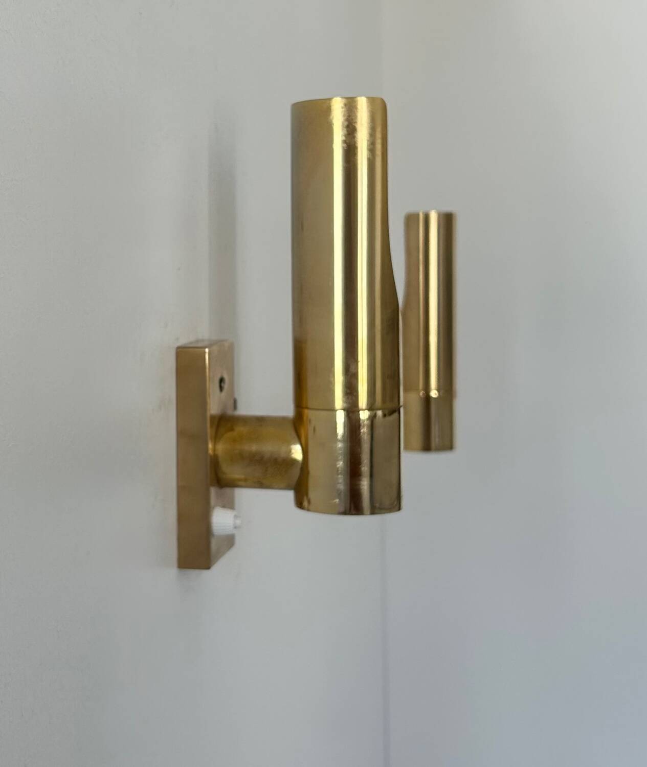 Pair of vintage adjustable brass wall lights, France 1970.