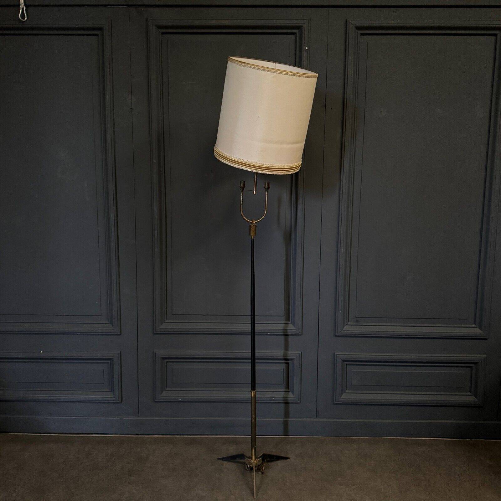 1960 floor lamp on gold metal winged base with black barrel