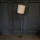 1960 floor lamp on gold metal winged base with black barrel