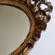 Louis xvi style oval mirror decorated with ribbons